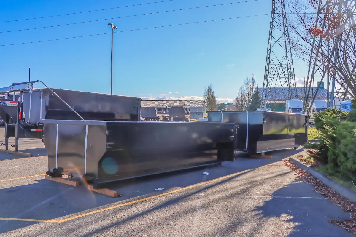 Roll-off dumpster ready for waste disposal at job site for Concrete Dumpster Rental in Monroe